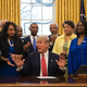 President Donald Trump prepares to sign an executive order to bolster historically black colleges and universities in the Oval Office of the White House in Washington, DC, February 28, 2017.